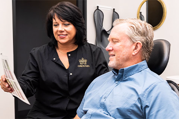 dentist showing patient results