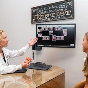 dentist showing xrays of teeth