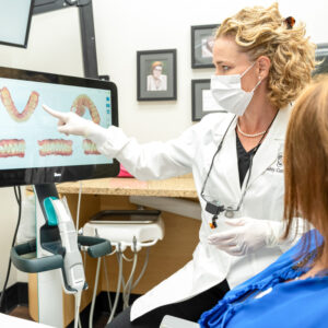 dentist showing xrays of teeth