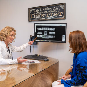 dentist showing xrays of teeth